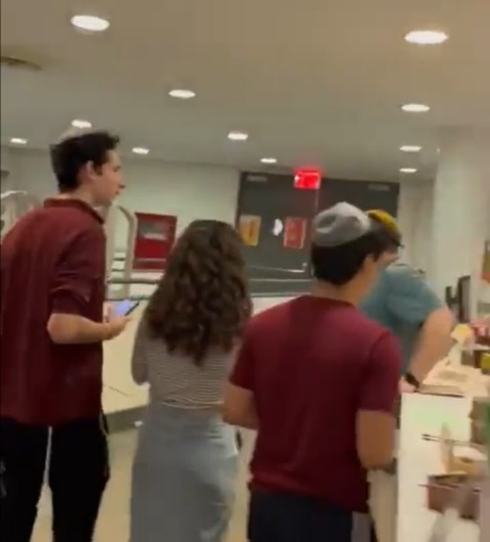 Jewish students in the library of Cooper Union College, locked inside the library as anti-Israel protesters demonstrate outside (Credit: STOPANTISEMITISM.ORG)