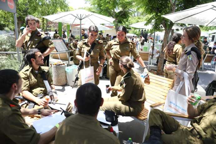 Lone Soldiers enjoy catching up while converting their foreign licenses to Israeli ones today in Holon. (Credit: YONIT SHILLER)