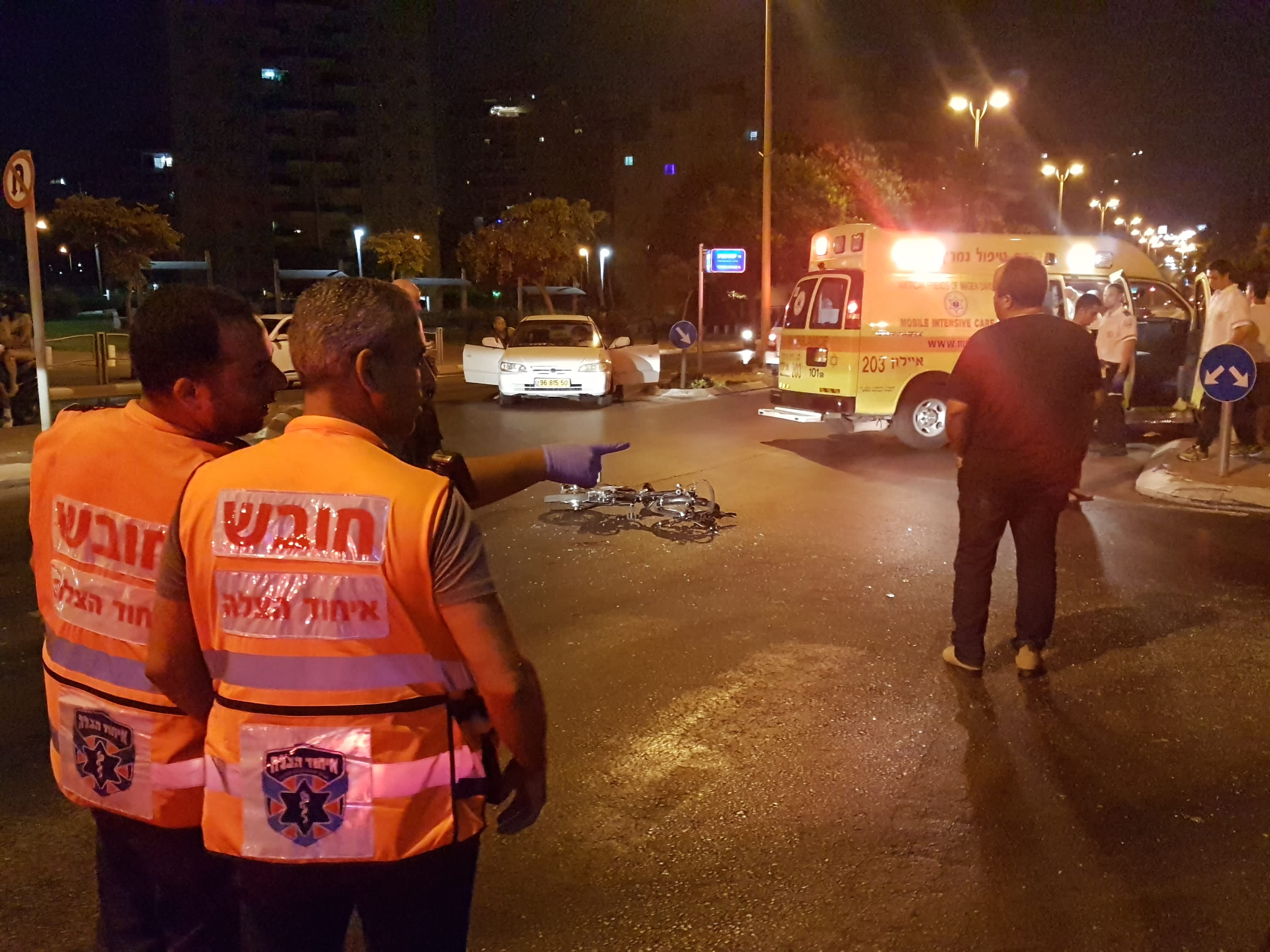 Two United Hatzalah volunteers assess the accident scene (credit: Becky Brothman)