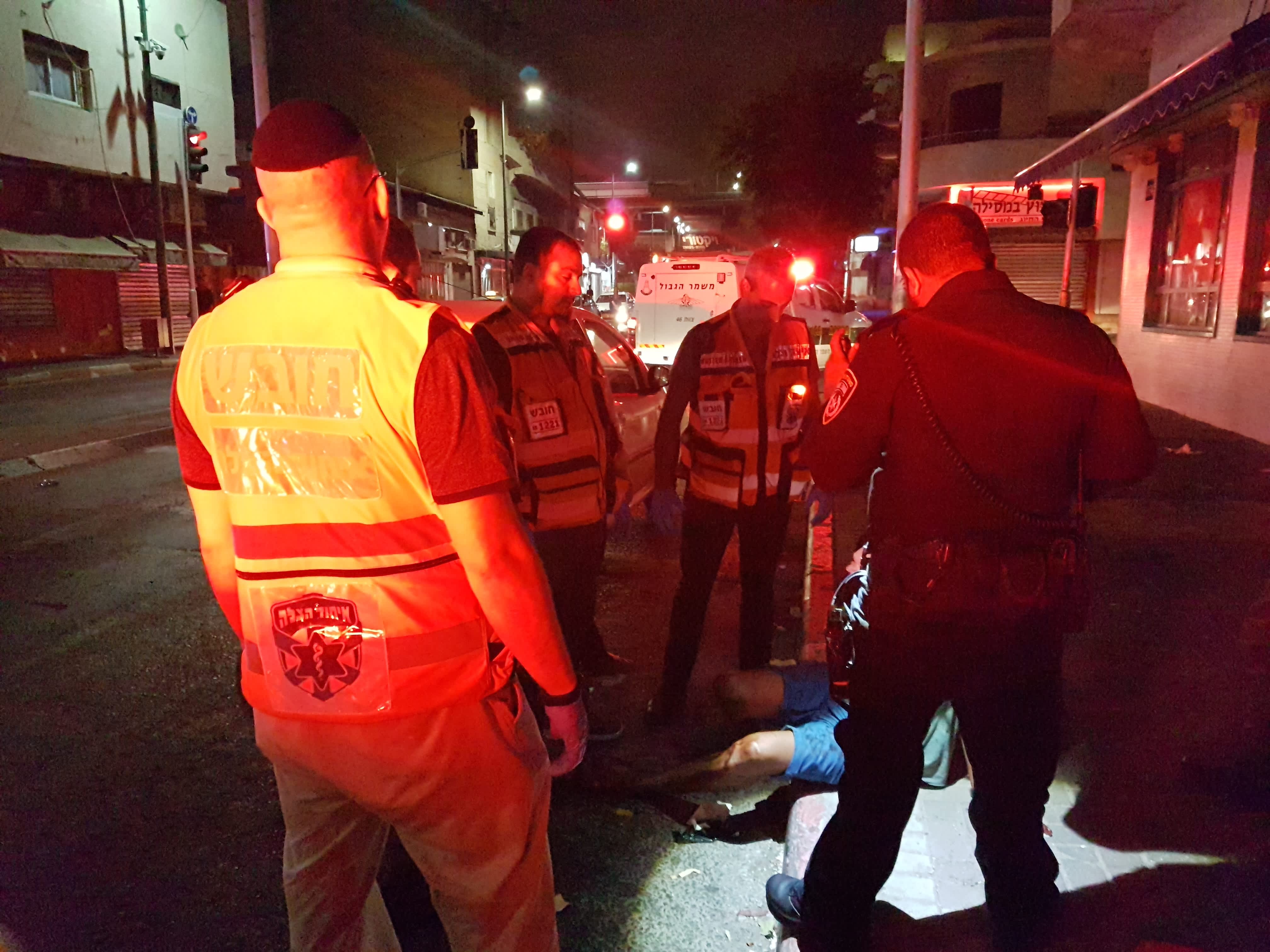 Police officers and United Hatzalah volunteers respond to the scene of a crime (credit: Becky Brothman)