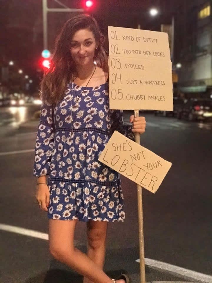 Protester holding an anti-Rachel Green sign in Rabin Square (credit: PAIGE WILSEY)