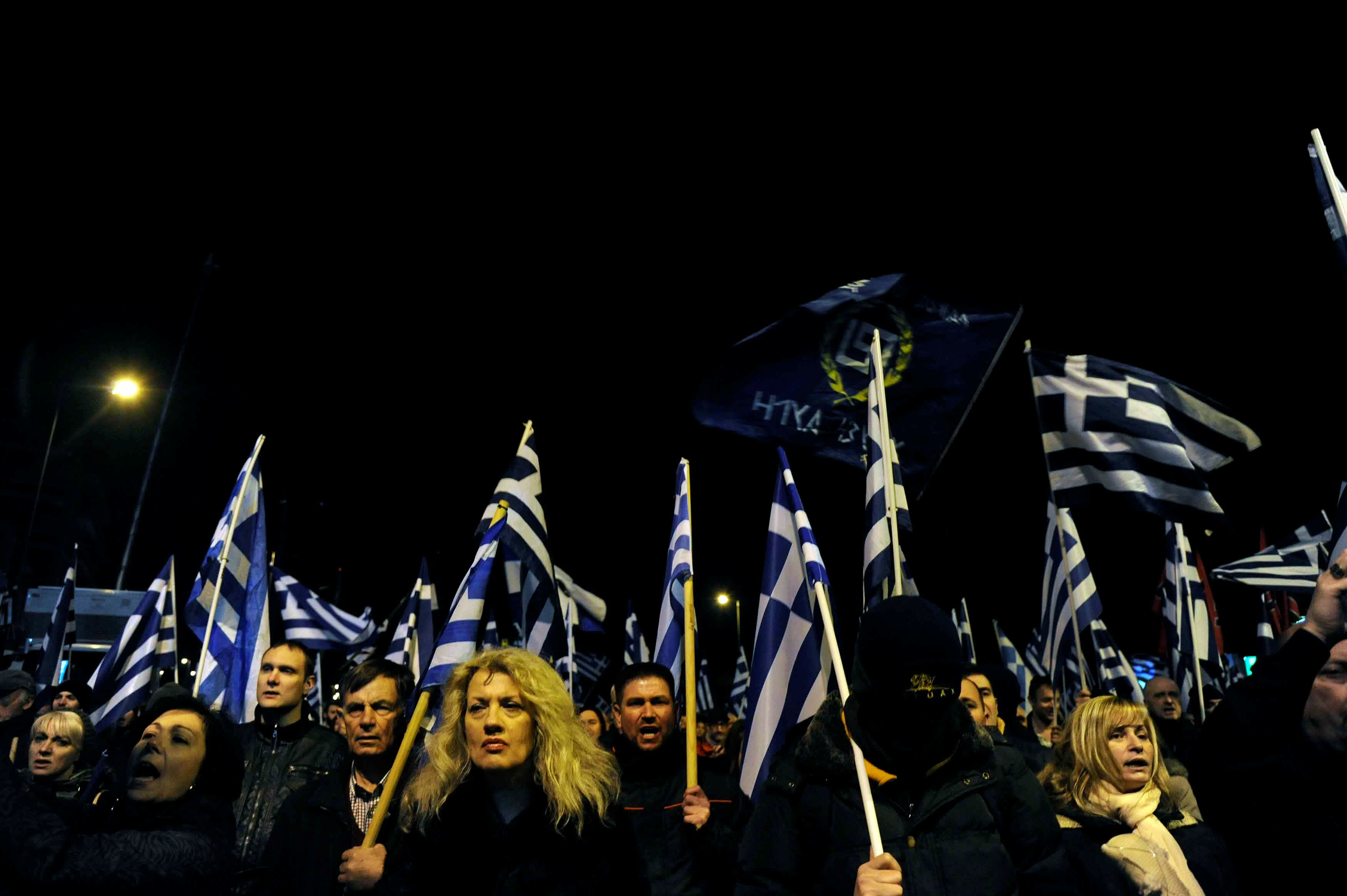 Supporters of Greece's far-right Golden Dawn party shout slogans as they wave national and party flags during an annual rally to commemorate the 21st anniversary of the Imia dispute, in Athens, Greece January 28, 2017. MICHALIS KARAGIANNIS/ REUTERS 