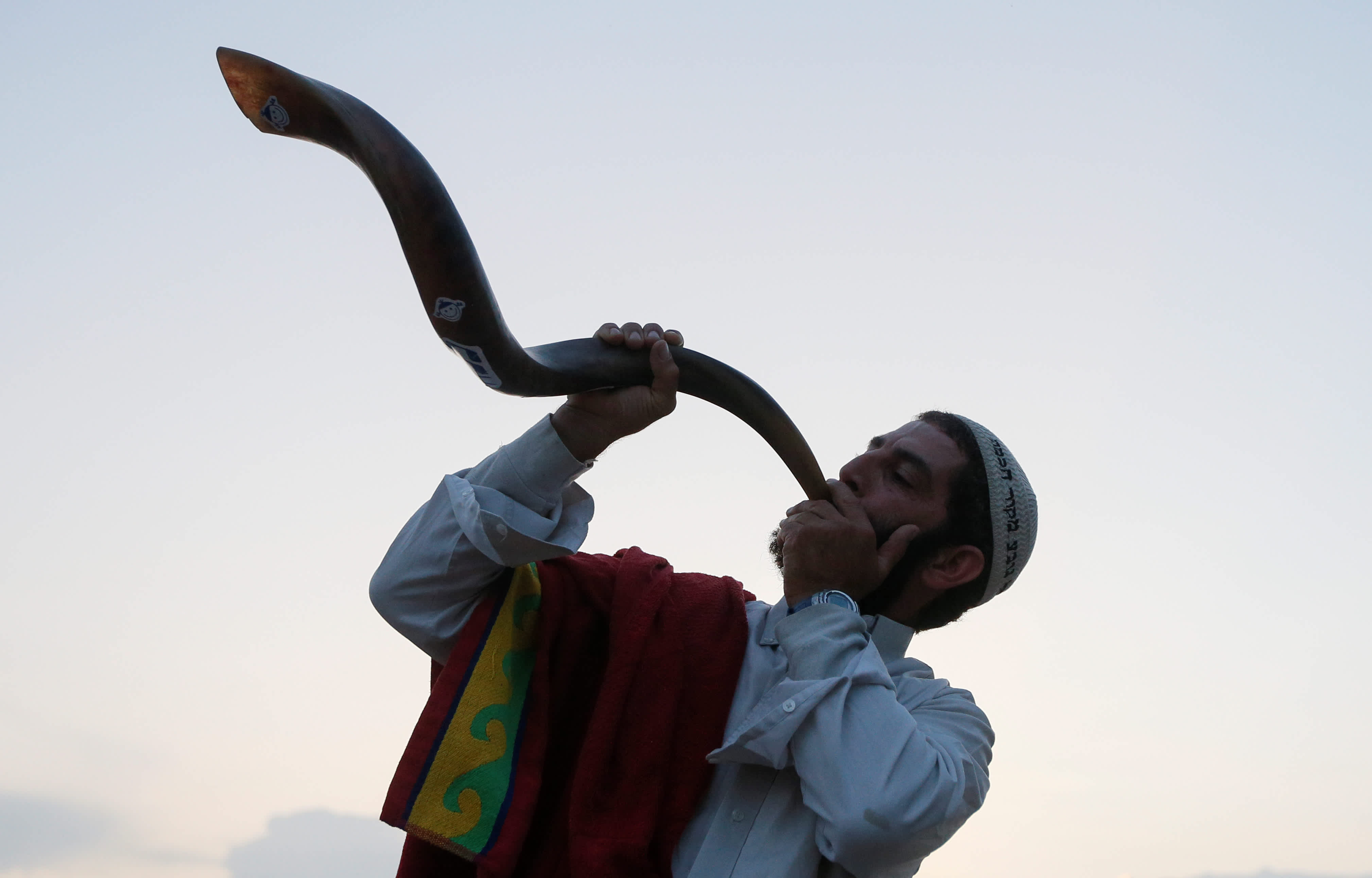 An ultra-Orthodox Jewish pilgrim blows a shofar, near the tomb of Rabbi Nachman of Breslov during the celebration of Rosh Hashana holiday, the Jewish New Year, in Uman, Ukraine, September 21, 2017. (Reuters)