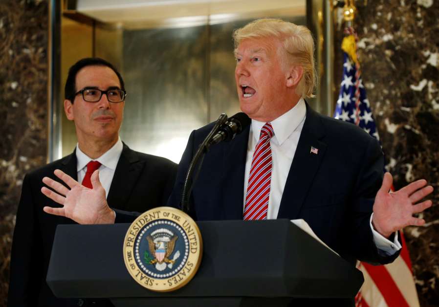 U.S. President Donald Trump answers questions about his responses to the deaths and injuries at the "Unite the Right" rally in Charlottesville as he talks to the media with Treasury Secretary Steven Mnuchin (L) at his side in the lobby of Trump Tower in Manhattan, New York, U.S., August 15, 2017.