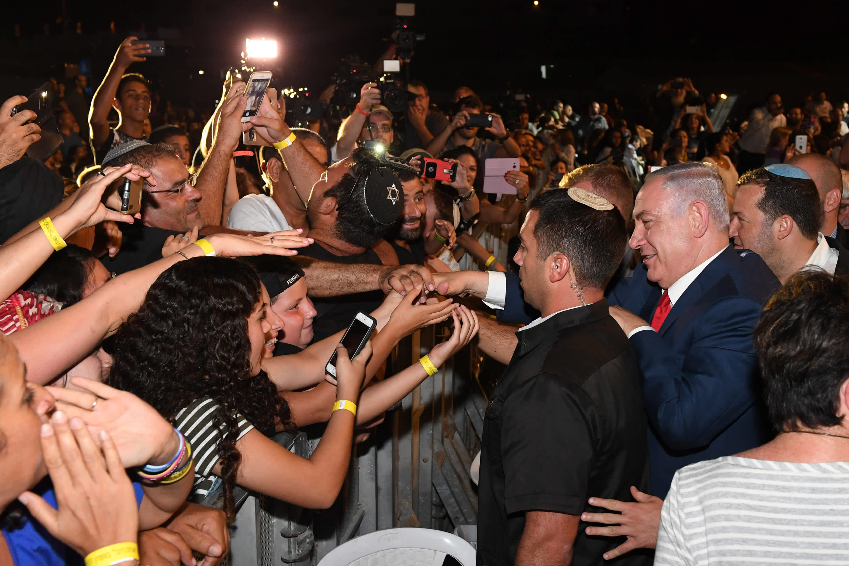 Prime Minister Benjamin Netanyahu greets the crowd at a ceremony celebrating 50 years of Jewish settlement in Judea and Samaria. (Prime Minister's Office)