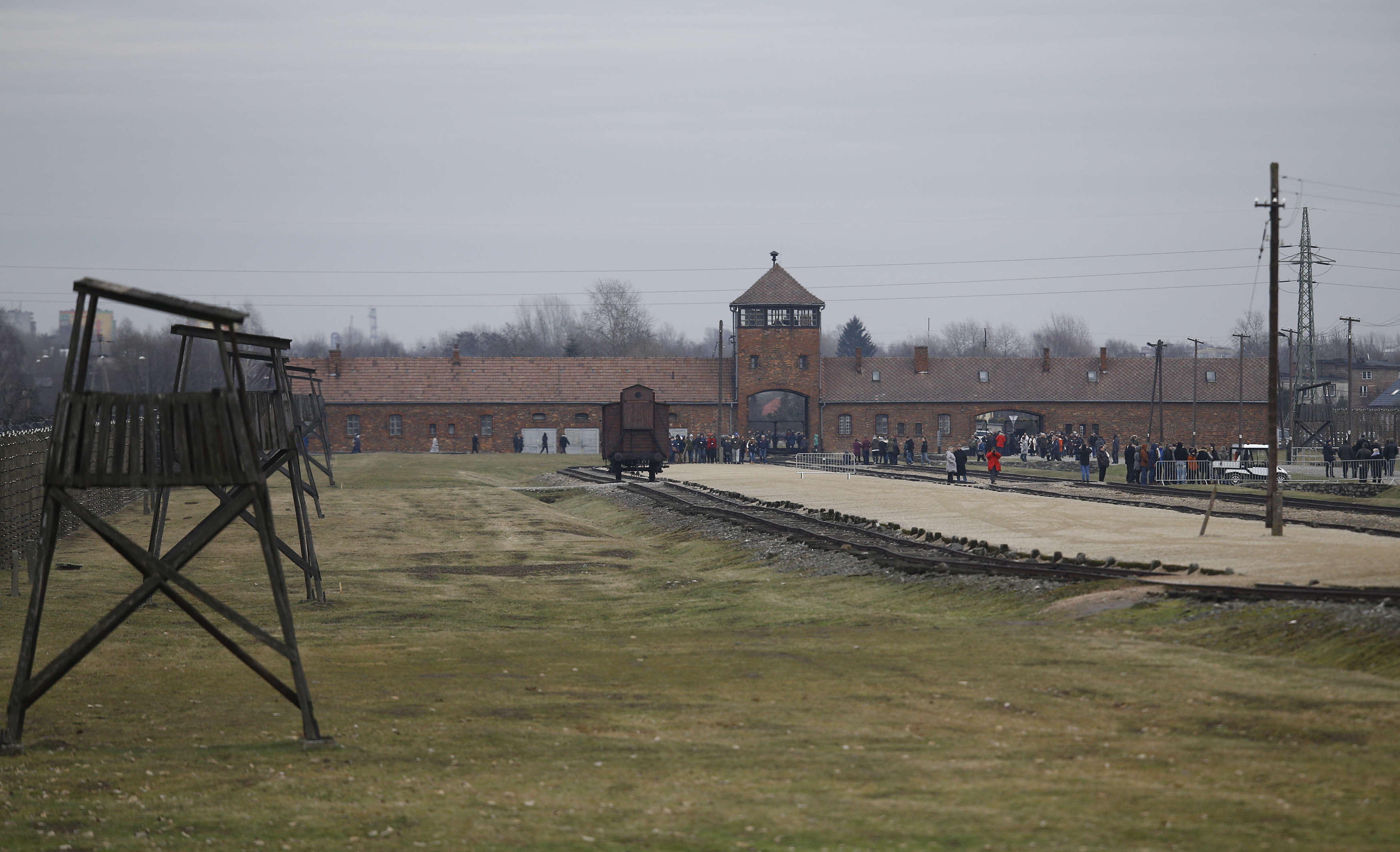 Visitors gather on the grounds of the former Nazi German concentration and extermination camp Auschwitz-Birkenau (Reuters)
