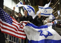 People hold U.S. and Israel flags as they chant during a Pro-Israel rally.