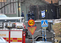  Emergency workers stand near the Israeli embassy in Stockholm, January 31, 2024