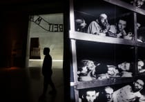  Visitors tour an exhibition ahead of Israel's national Holocaust memorial day, at Yad Vashem