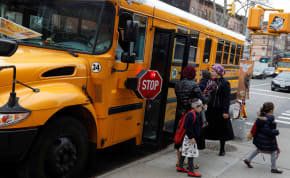 Orthodox Jewish children get off a Yeshiva school bus, as New York City Mayor Bill de Blasio declared a public health emergency in parts of Brooklyn in response to a measles outbreak, in the Williamsburg neighborhood of Brooklyn in New York City, US, April 9, 2019.
