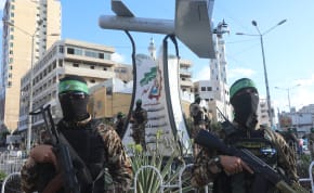 Palestinian members of Izz ad-Din al-Qassam Brigades, the armed wing of the Hamas movement seen next to a memorial named “Shehab Field,” a drone made by al-Qassam, in Gaza City, September 21, 2022.