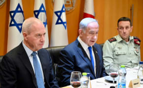 Defense Minister Yoav Gallant, Prime Minister Benjamin Netanyahu and IDF Chief of Staff Herzi Halevi attend a Passover celebration on Tuesday April 4, 2023. 