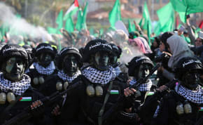  Members of Qassam Brigades choir attend a rally marking the 35th anniversary of the Hamas movement's founding, in Gaza City December 14, 2022. 