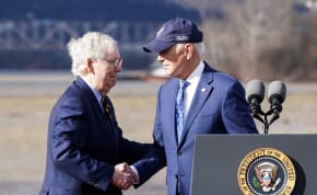  U.S. President Joe Biden shakes hands with U.S. Senate Republican Leader Mitch McConnell (R-KY) during an event to tout the new Brent Spence Bridge over the Ohio River between Covington, Kentucky and Cincinnati, Ohio near the bridge in Covington, Kentucky, U.S., January 4, 2023. 