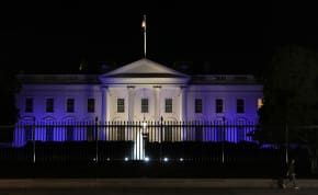 The White House is lit with the colors of the Israeli flag in Washington, US, October 9, 2023.
