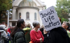  People attend a vigil in front of the Fraenkelufer synagogue in Berlin, Germany, October 13, 2023.