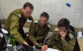  IDF soldiers are seen working as part of the Israeli military's Gaza battlefield intelligence collection unit.