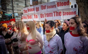  Demonstrators gather during a protest the crimes and sexual violence against women in October 7 massacre, outside of United Nations headquarters in New York City, on December 4, 2023. 