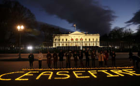  Staff and volunteers of Amnesty International USA, MoveOn, Oxfam America and Win Without War hold a vigil outside the White House calling for a ceasefire in the ongoing conflict between Israel and the Palestinian Islamist group Hamas, in Washington, U.S., December 18, 2023. 