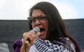  Rep. Rashida Tlaib (MI-12) addresses attendees as she takes part in a protest calling for a ceasefire in Gaza outside the U.S. Capitol