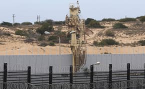  A border wall stands between Rafah and Egypt, amid fears of an exodus of Palestinians into Egypt, as the conflict between Israel and Hamas continues, in Rafah southern Gaza Strip February 16, 2024
