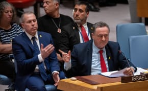  Israel Katz, Foreign Minister to the United Nations points at family members of hostages in the audience during a meeting of the United Nations Security Council on the conflict between Israel and Hamas, at U.N. headquarters in New York, US March 11, 2024.
