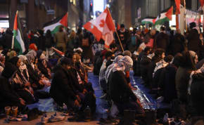  Supporters of a ceasefire in Gaza pray as they gather to protest outside the venue of a Liberal Party fundraising rally featuring Canada's Prime Minister Justin Trudeau, amid the ongoing conflict between Israel and the Palestinian Islamist group Hamas, in Toronto, Ontario, Canada, March 15, 2024. 