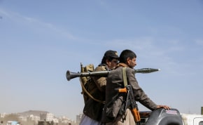  Armed Houthi followers ride on the back of a pick-up truck during a parade in solidarity with the Palestinians in the Gaza Strip and to show support to Houthi strikes on ships in the Red Sea and the Gulf of Aden, in Sanaa, Yemen January 29, 2024. 