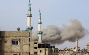  Smoke rises following an Israeli strike in Rafah, in the southern Gaza Strip, March 27, 2024