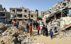  Palestinians inspect the site of an Israeli strike, amid the ongoing conflict between Israel and the Palestinian terrorist group Hamas, in Rafah, in the southern Gaza Strip, March 27, 2024.