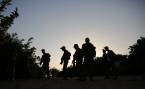  Bedouin Arab Israeli Defense Force soldiers take part in a night-time tracking drill near Tze'elim in southern Israel June 9, 2014.