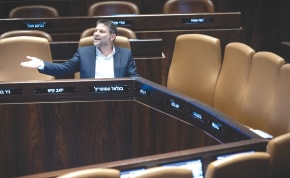  FINANCE MINISTER Bezalel Smotrich sits among empty seats at the cabinet table in the Knesset plenum. A major part of our problem is the structure of our parliamentary system which makes ministerial assignments a reward for party loyalty and support for the coalition, says the writer.