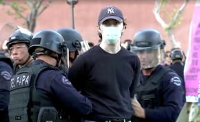  Police arrest a pro-Palestinian protester at USC campus in Los Angeles, California, U.S., April 24, 2024, in this still image taken from video