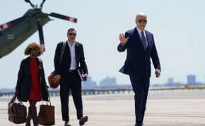  US President Joe Biden waves as he walks to board Air Force One to return to Washington from JFK Airport in New York City, US, April 26, 2024.
