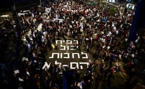 Protesters in Tel Aviv demonstrate against the government, with the message "Rafah can wait, they can't," referring to the hostages still in Gaza.