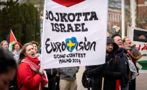  People hold a banner at a demonstration in connection with the municipal board's consideration of a citizens' proposal by the initiative 'No Eurovision in Malmo with Israel's participation' to stop Israel's participation in Eurovision, outside the City Hall in Malmo, Sweden, April 10, 2024. 