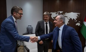  Palestinian Prime Minister Mohammad Shtayyeh shakes hands with the Head of Representative Office of the Federal Republic of Germany in the Palestinian territories, Oliver Owcza, while he receives German Vice-Chancellor Robert Habeck, at his office in the West Bank city of Ramallah, June 7, 2022.