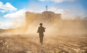  An IDF soldier walks through the Gaza Strip.