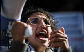 A protester leads a chant as students and workers hold a pro-Palestinian rally near MIT's Stata Center, demanding MIT divest from Israel, among other demands, in Cambridge, Massachusetts, U.S. May 9, 2024.