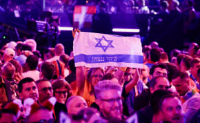  A person holds a flag during the Grand Final of the 2024 Eurovision Song Contest, in Malmo, Sweden, May 12, 2024. 