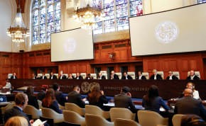  Judges and delegates sit in the courtroom during a public hearing at the International Court of Justice (ICJ) in The Hague, Netherlands, April 30, 2024. 