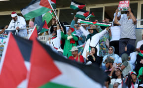  Soccer Football - South Africa Invitation XI v Palestine - Athlone Stadium, Cape Town, South Africa - February 18, 2024 Fans display flags in support of Palestine amid the ongoing conflict between Israel and Hamas.