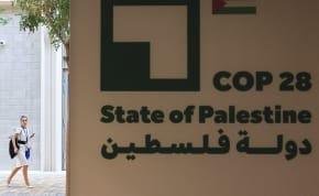  A WOMAN walks near the State of Palestine Pavilion at the UN Climate Change Conference COP28 in Dubai, last December. In multiple ways, the Arab side has rejected the two-state solution or undermined its application, the writer argues.