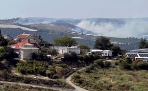  Smoke billows over northern Israel after rockets were fired from Lebanon, amid ongoing cross-border hostilities between Hezbollah and Israeli forces, by Israel's border with Lebanon, May 17, 2024.