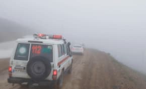 An ambulance and other vehicles drive on a foggy road following a crash of a helicopter carrying Iran's President Ebrahim Raisi, in Varzaqan , East Azerbaijan Province, Iran, May 19, 2024 in this screen grab from a video.