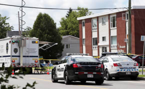  Fredericton Police and Royal Canadian Mounted Police (RCMP) investigate apartment complex which was the scene of a shooting incident in Fredericton, New Brunswick, Canada August 10, 2018.