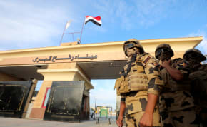  Military personnel stand guard on the Rafah border crossing between Egypt and the Gaza Strip, October 31, 2023
