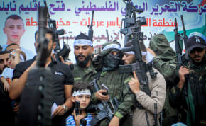  Palestinian terrorists from Fatah carry their weapons during a parade in the Balata refugee camp in the West Bank city of Nablus, September 29, 2023
