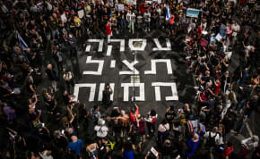 Demonstrators protest calling for the release of hostages held in the Gaza Strip, in Tel Aviv, June 12, 2024
