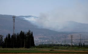 Smoke rises, amid ongoing cross-border hostilities between Hezbollah and Israeli forces, in Kiryat Shmona, northern Israel, June 14, 2024.
